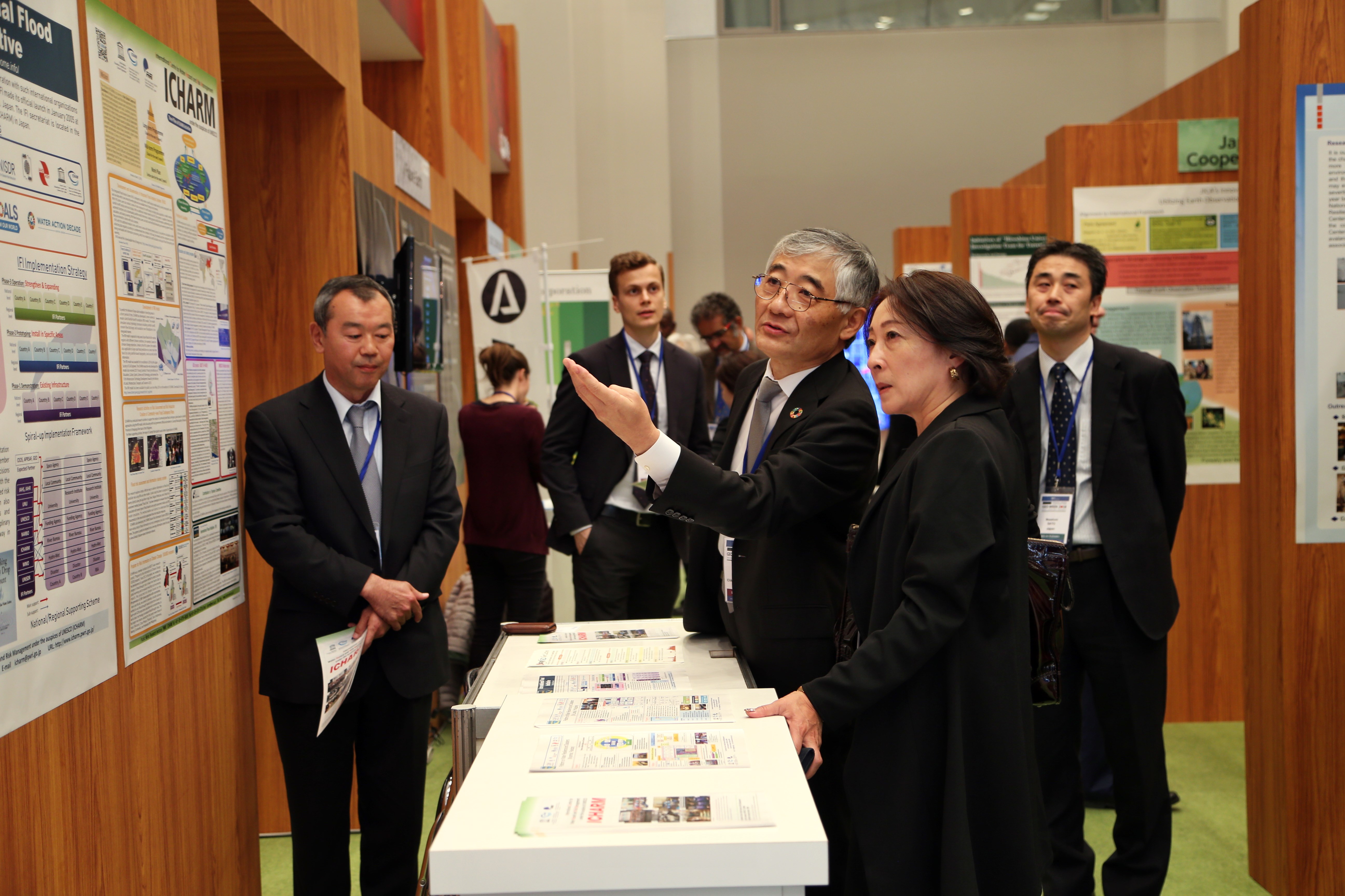 ICHARM Director Toshio Koike speaks with Mami Mizutori, Special Representative of the United Nations Secretary-General for Disaster Risk Reduction, at the GEO Week 2018 Exhibition.