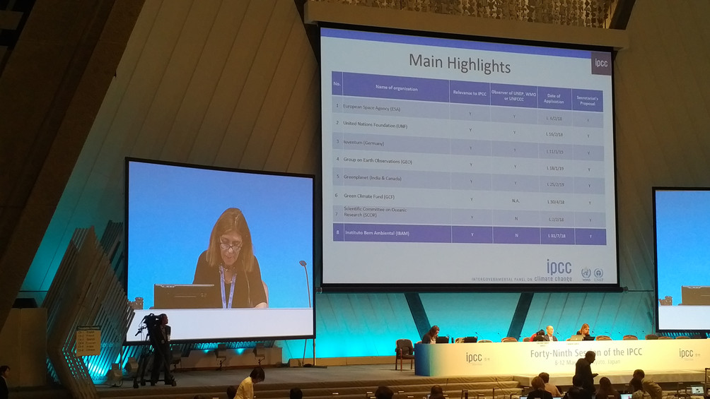 Sophie Schlingemann, IPCC Secretariat, announces new Observers to the Intergovernmental Panel on Climate Change at its 49th Session in Kyoto. Photo: Douglas Cripe / GEO Secretariat