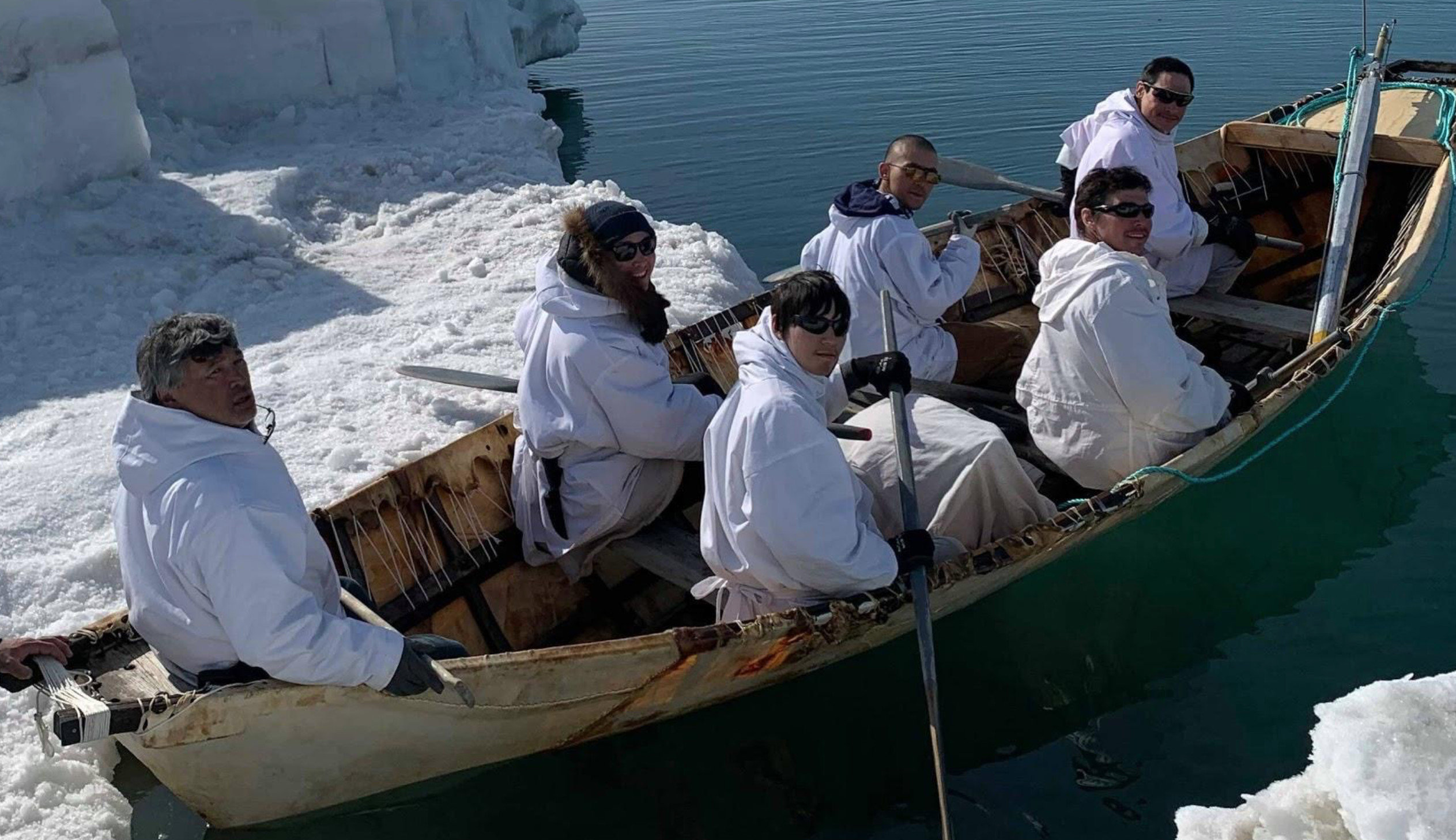 Gordon Ikayuak Brower and his whaling crew about to get out in open water on their traditional umiaq/seal skin boat. Photo: Courtesy of Gordon Ikayuak Brower