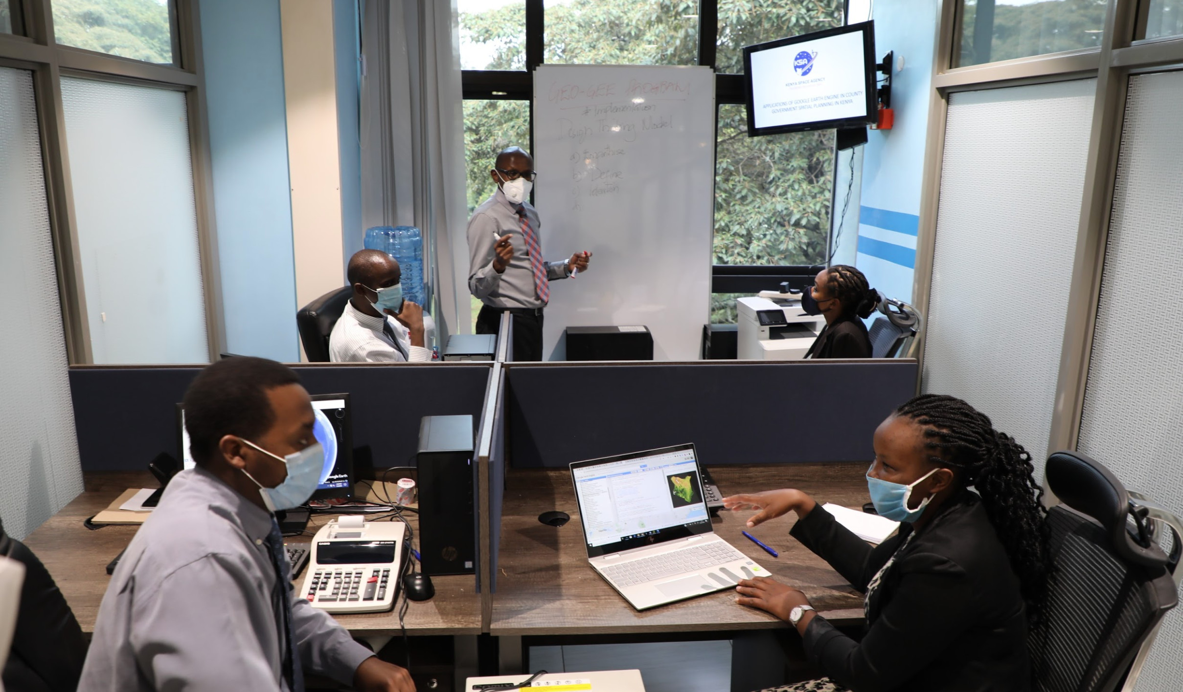 Kenya Space Agency Project team led by Mr. Charles Mwangi (standing) planning the implementation of the GEO-GEE unlimited license award.